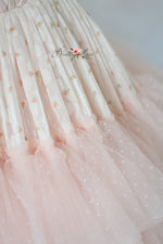 Chiffon and tulle formal gown with structured bodice and romantic movement.


