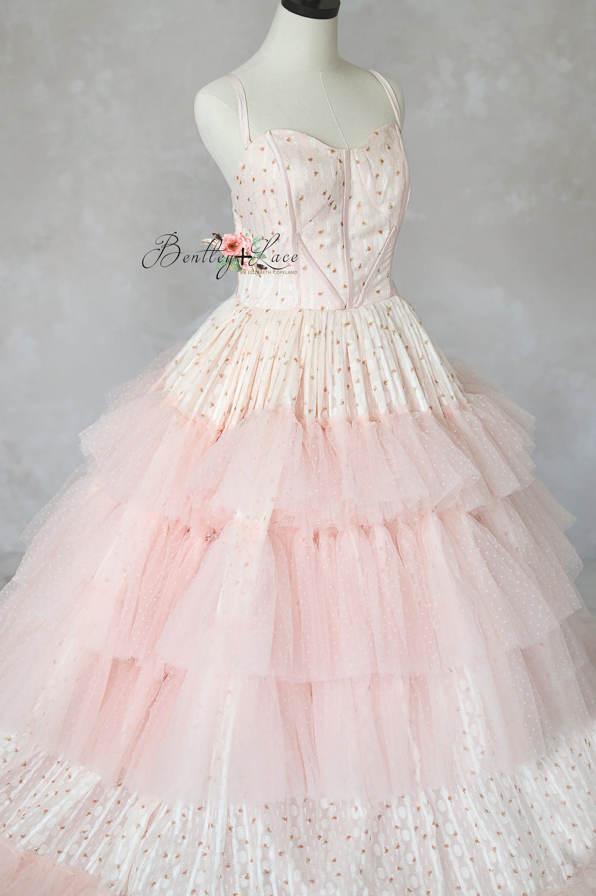 Elegant teen and adult gown with supportive bodice and flowing layers.

