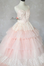 Elegant teen and adult gown with supportive bodice and flowing layers.

