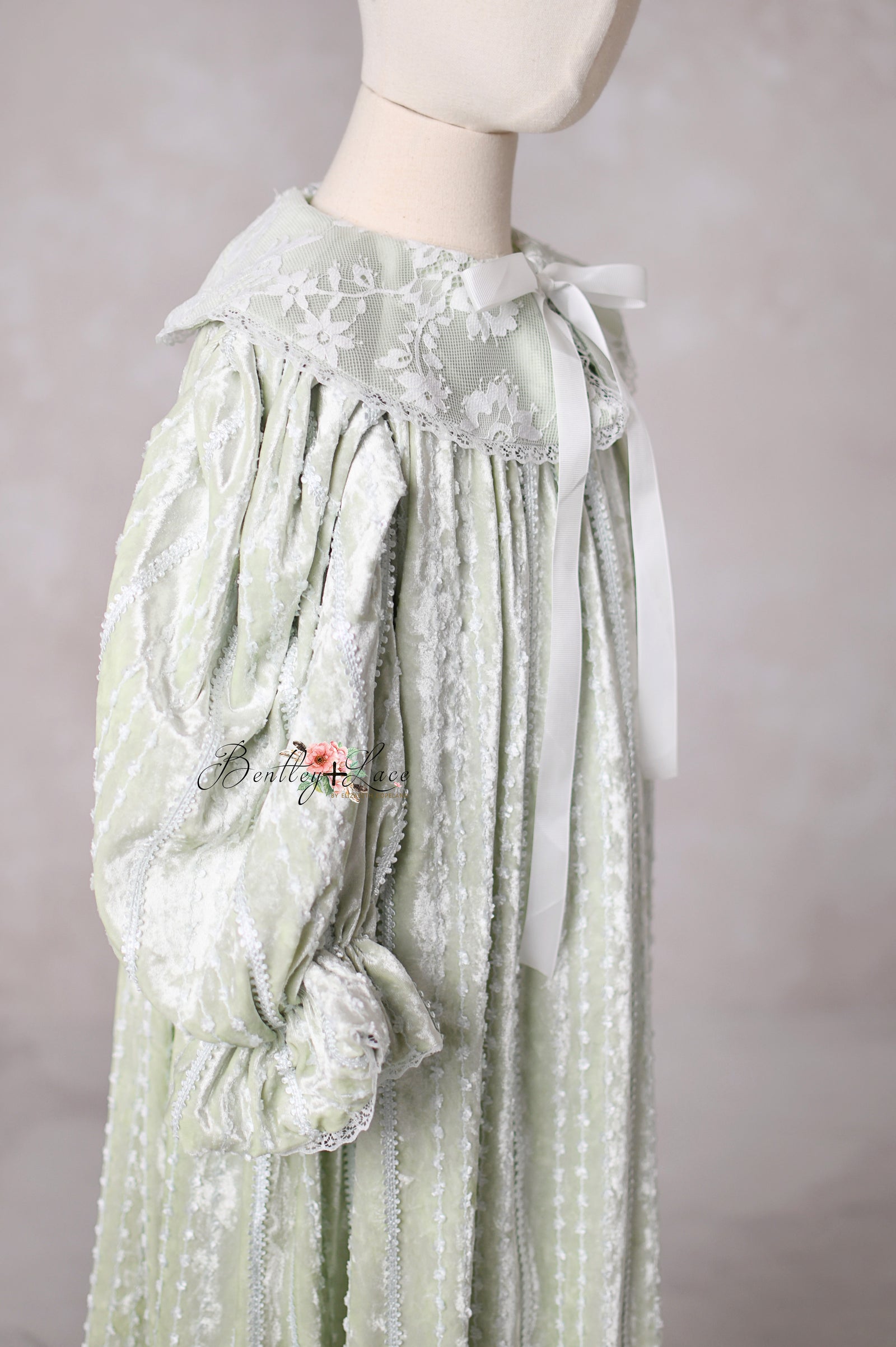 Elegant vintage-style sage dress Eleanor’s Dream featuring faux button closure and hidden back zipper for easy dressing.


