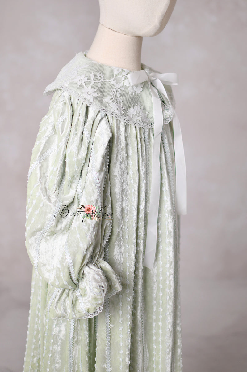 Elegant vintage-style sage dress Eleanor’s Dream featuring faux button closure and hidden back zipper for easy dressing.

