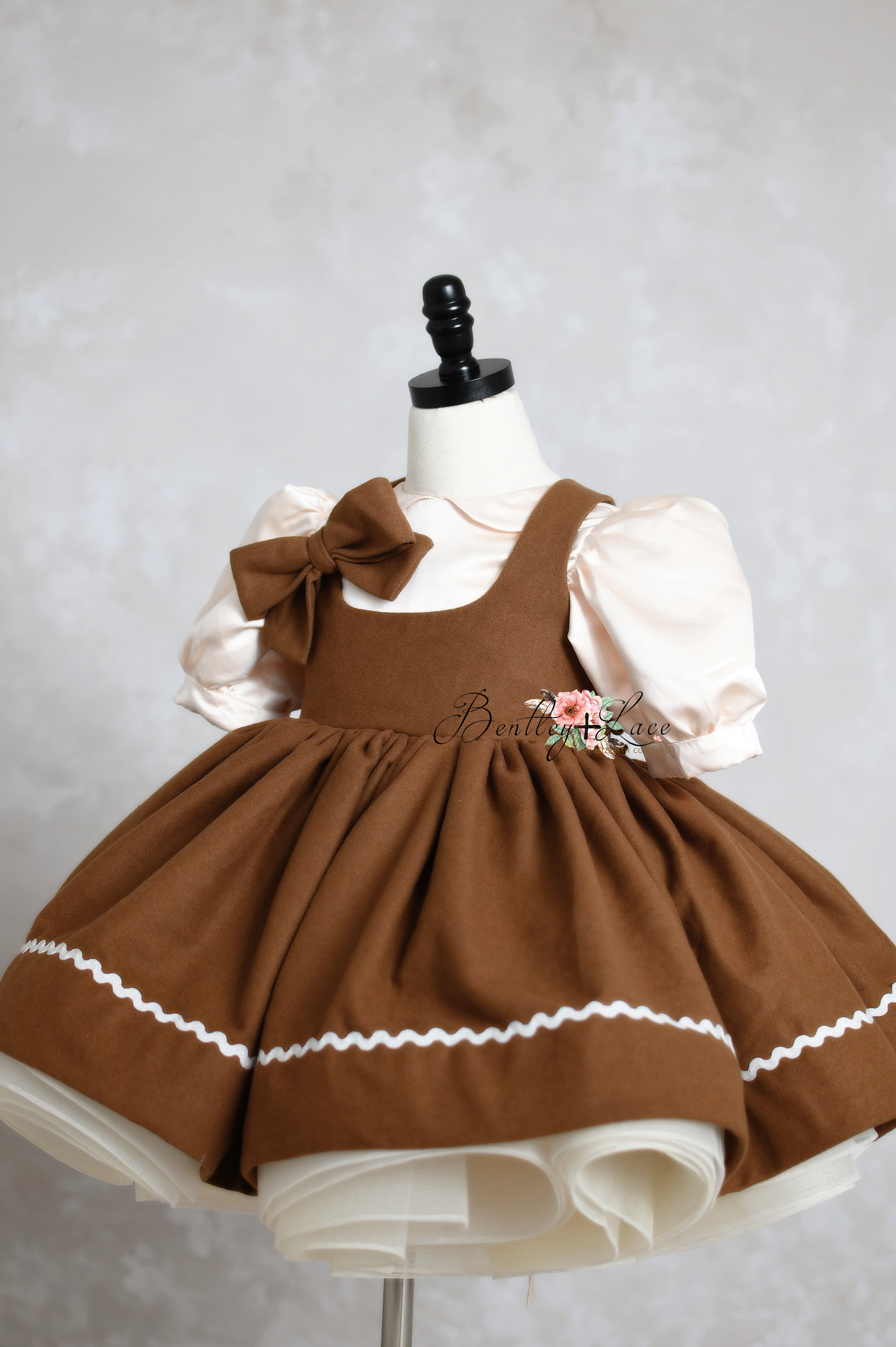 gingerbread-themed holiday dress with a removable apron, adjustable shoulder ties, and elastic waistband, perfect for festive photography sessions.