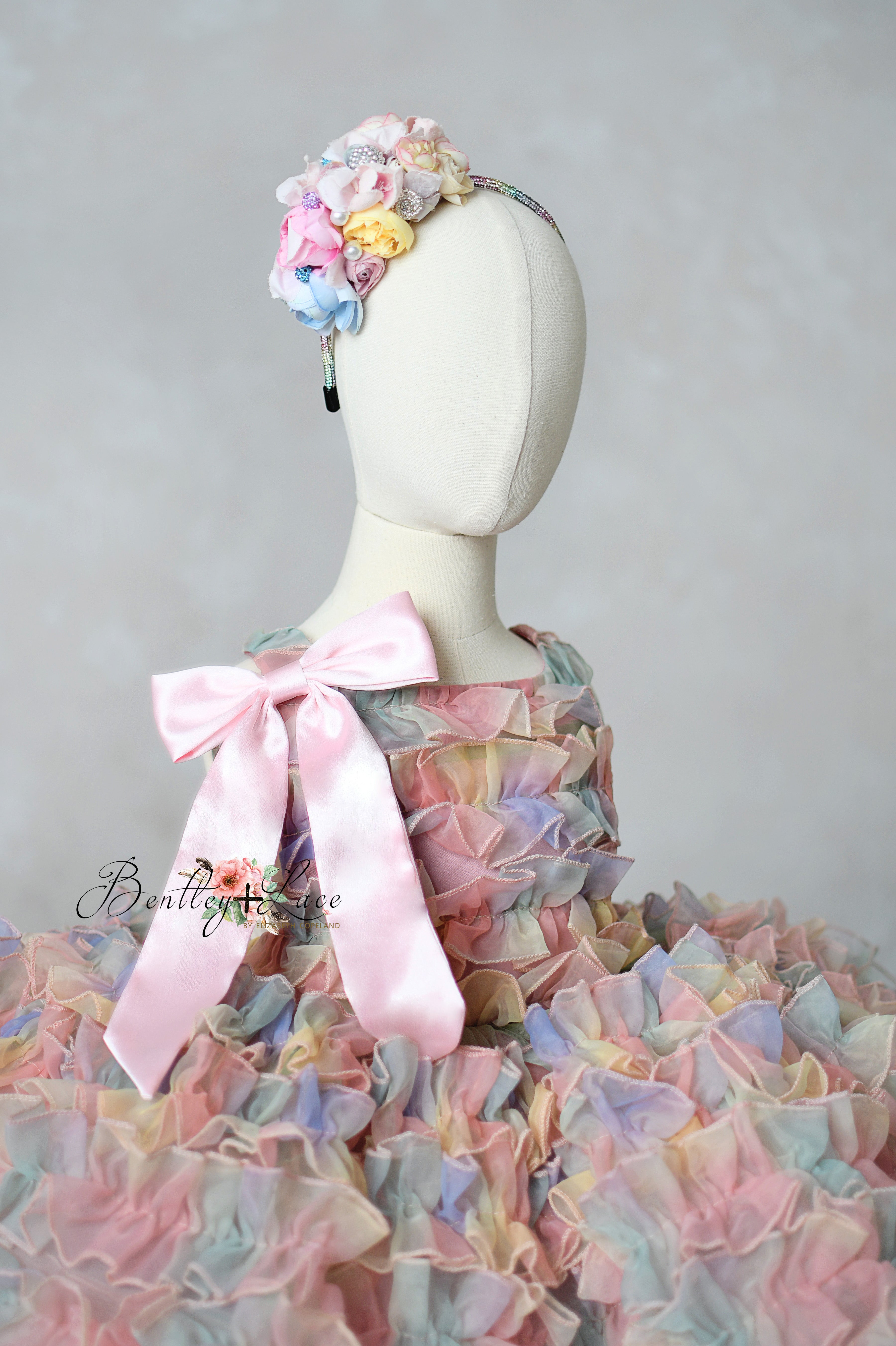 Sleeveless version of convertible dress with pastel organza ruffles

