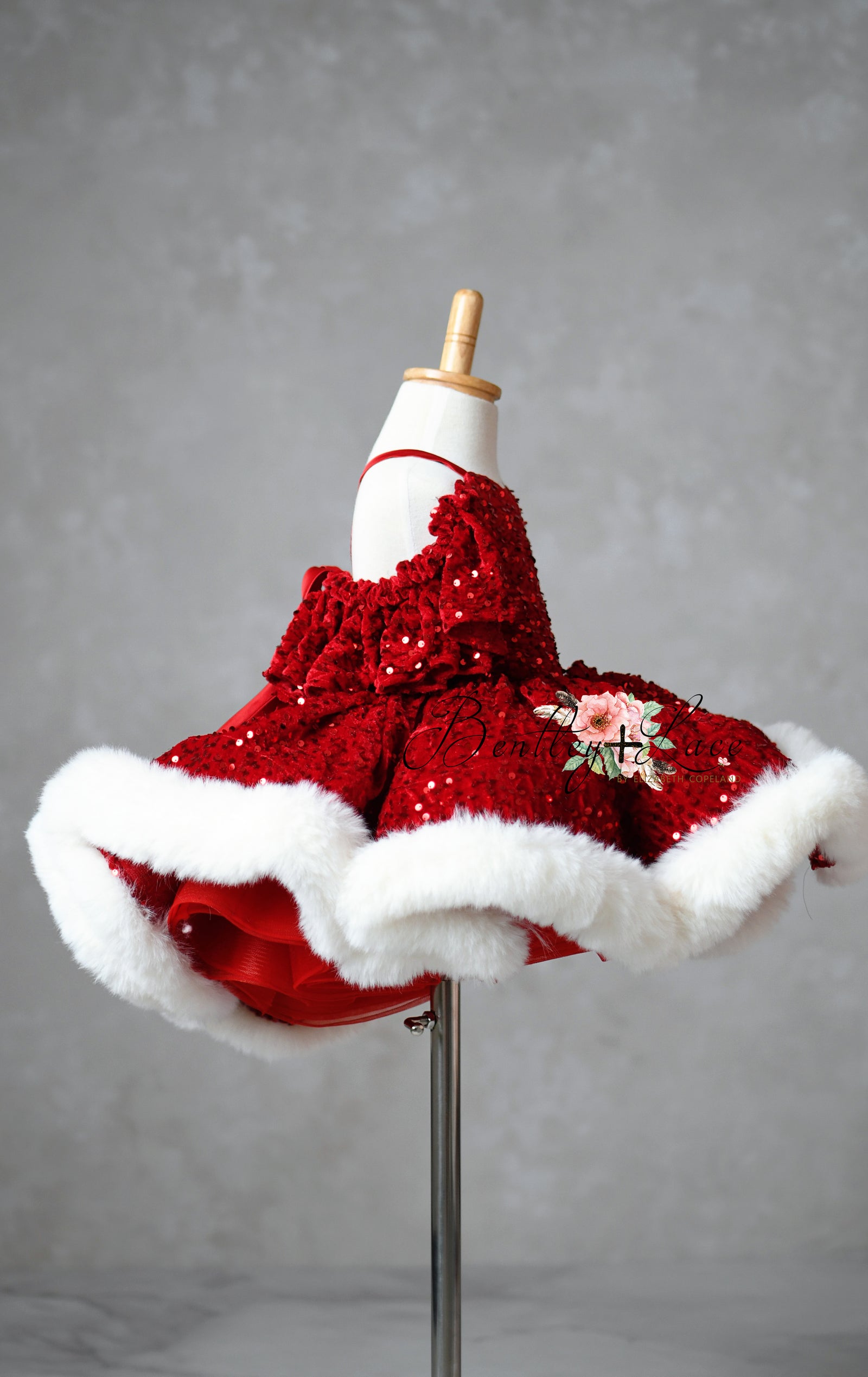 Velvet sequin gown with faux fur hem in holiday setting

