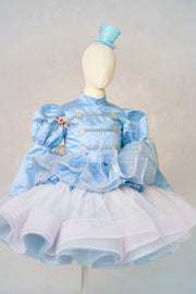 Light blue dress with ruffled details on a mannequin against a plain background