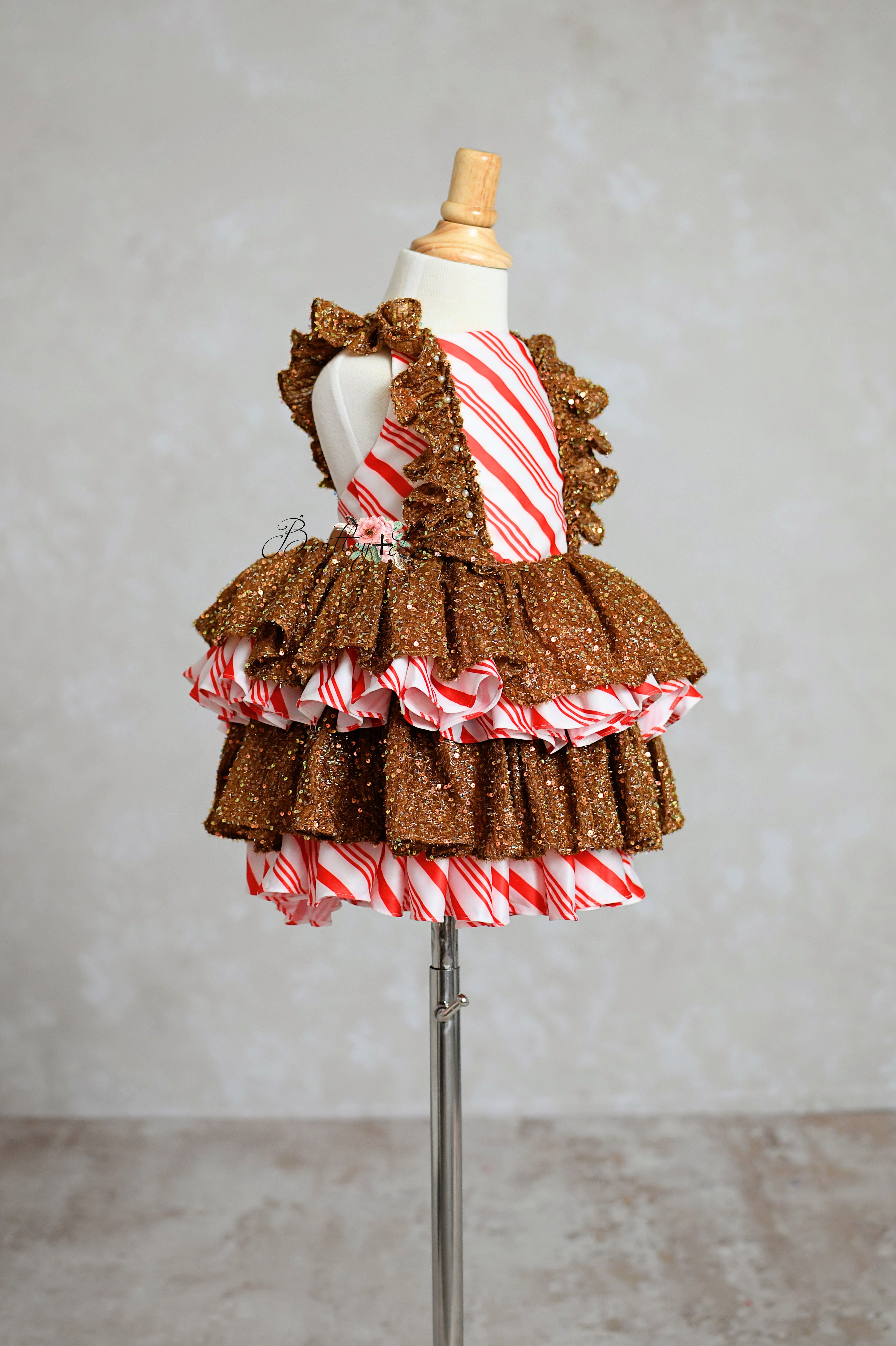 Red and white striped holiday dress with tinsel fabric accents