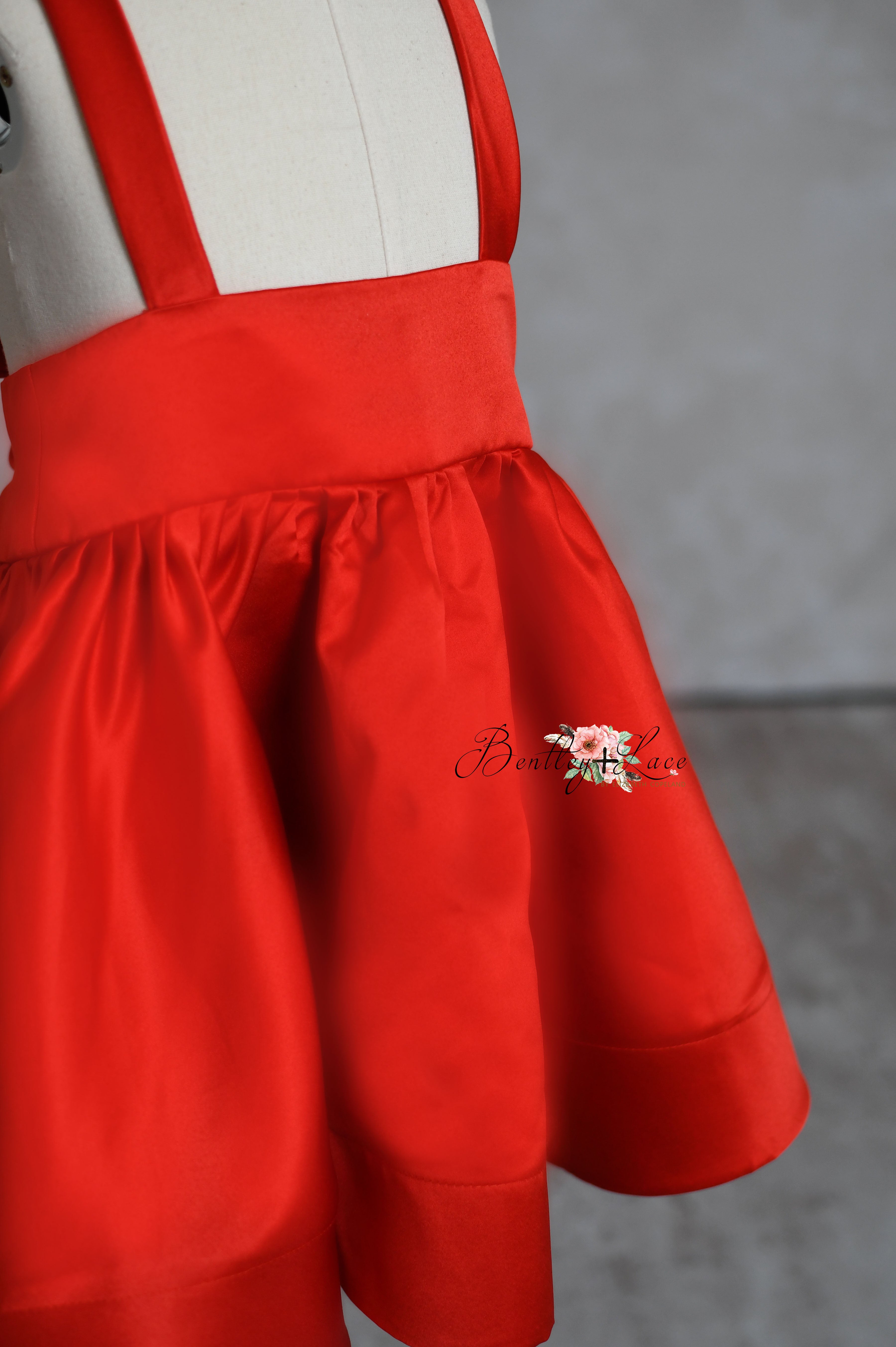 "Close-up of the Solid Satin Detachable Apron Dress, highlighting the intricate satin texture and detachable apron detail for a versatile look."

