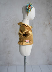 Back view of the Golden Belle dress showing elastic back detail.
