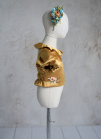 Back view of the Golden Belle dress showing elastic back detail.