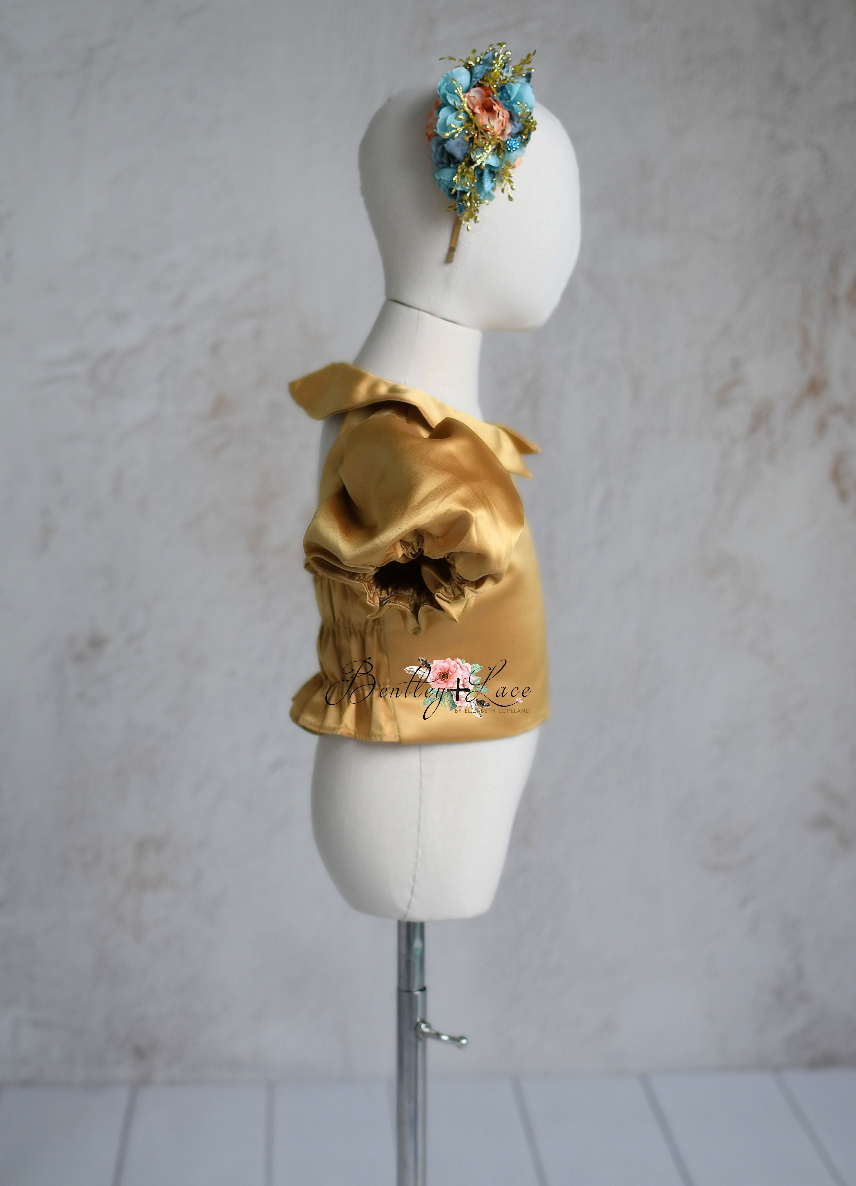 Back view of the Golden Belle dress showing elastic back detail.