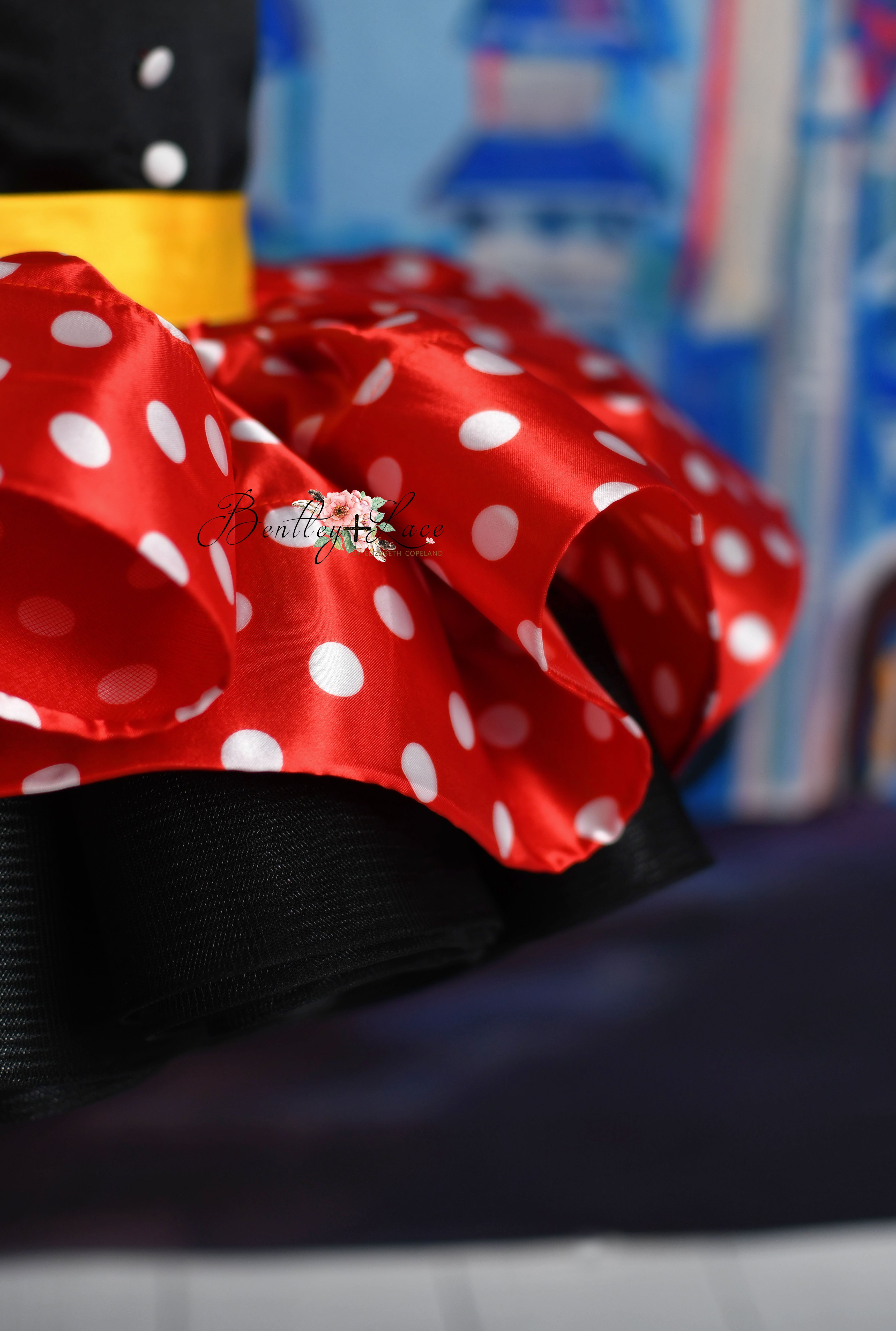 Adorable petal-length gown for toddler girls in Minnie Mouse-inspired polka dots.