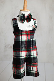 Classic plaid toddler outfits in red, black, and white, featuring bow ties, on display.