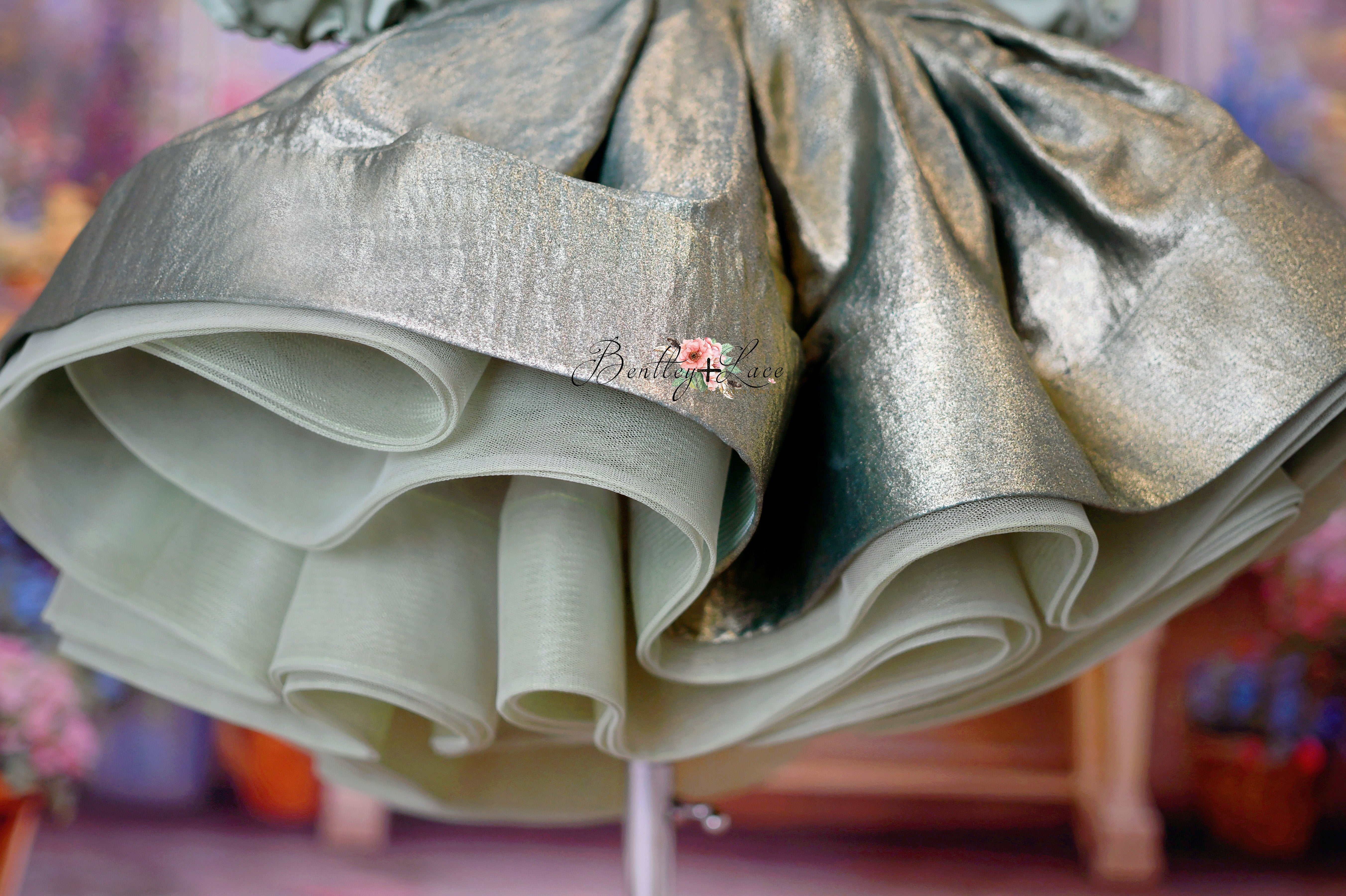 Bottom profile of the Golden Belle Dress highlighting the flowing petal-apron skirt.