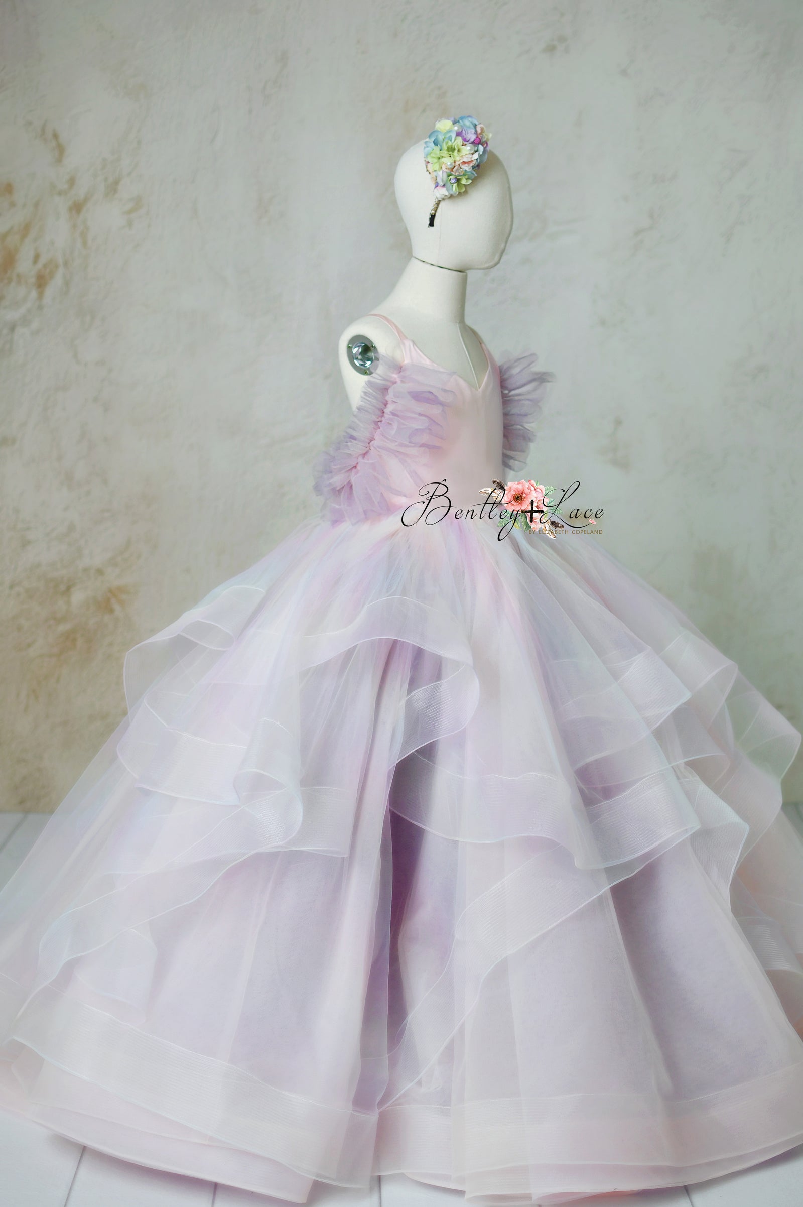 Chasing Rainbows gown with customizable pastel colors and detachable tulle sleeves, perfect for special occasions.
