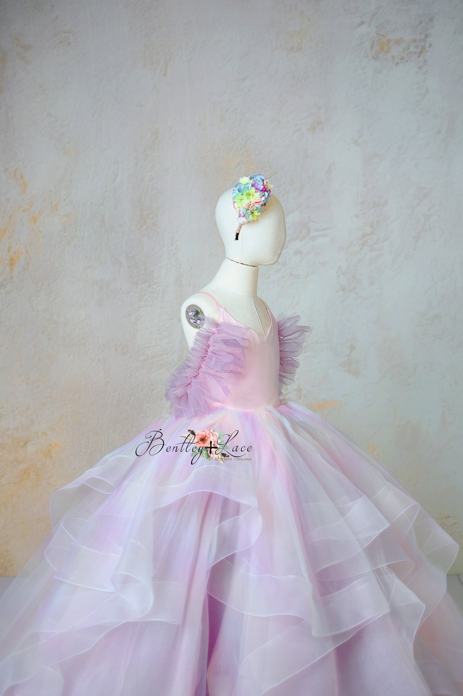 Ethereal pastel dress from Chasing Rainbows collection with tulle sleeves, ideal for photography events.
