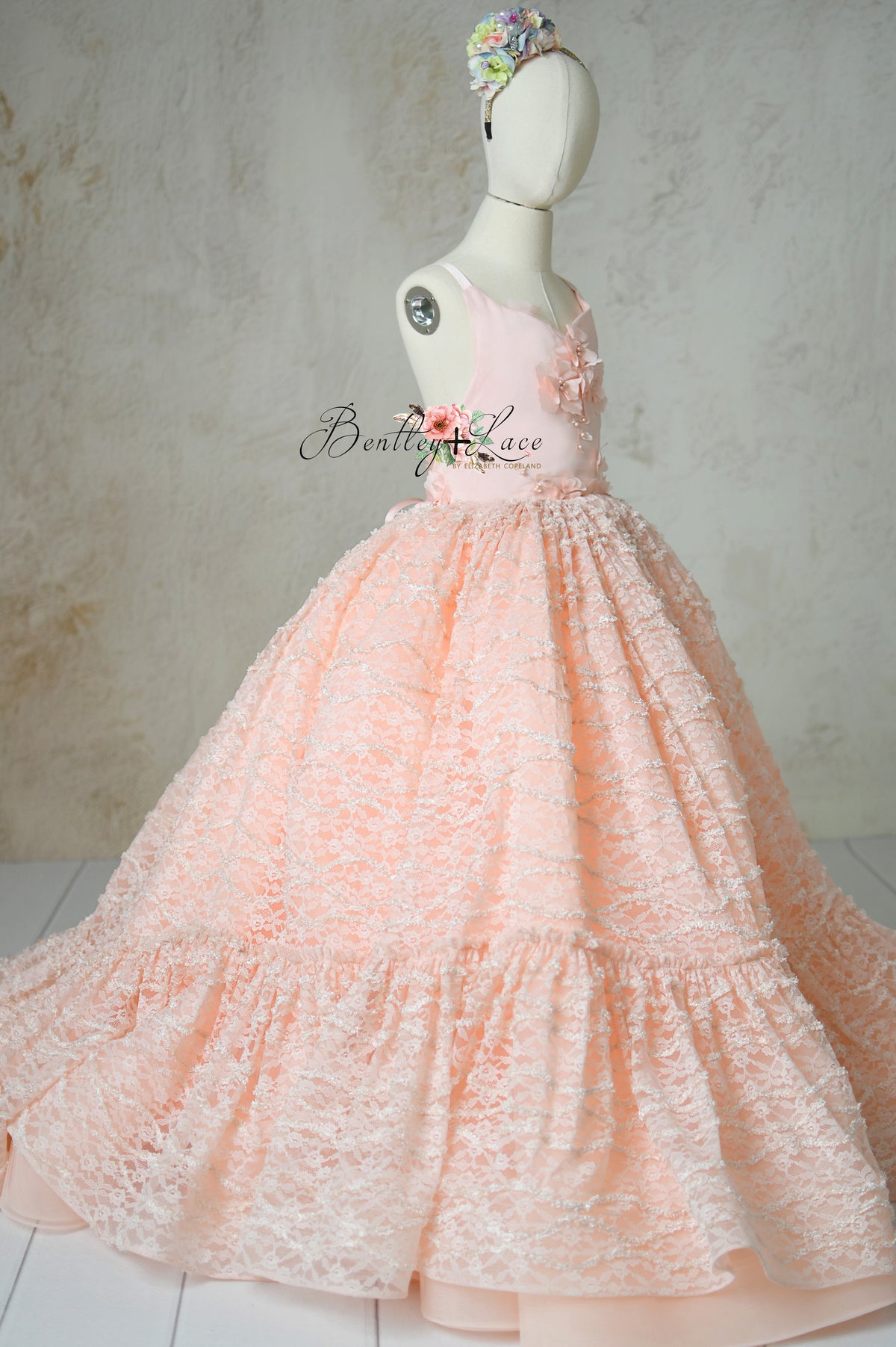 Peachy-pink Rosette Reverie gown with lace overlay and tulle skirt.
