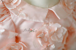 Rosette Reverie gown styled for a special occasion setup.
