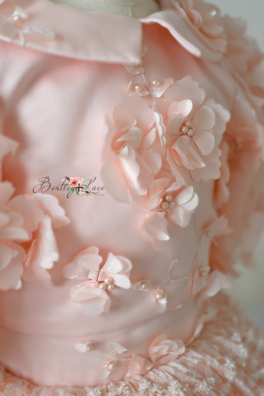 3D floral appliqué details on Rosette Reverie capelet.
