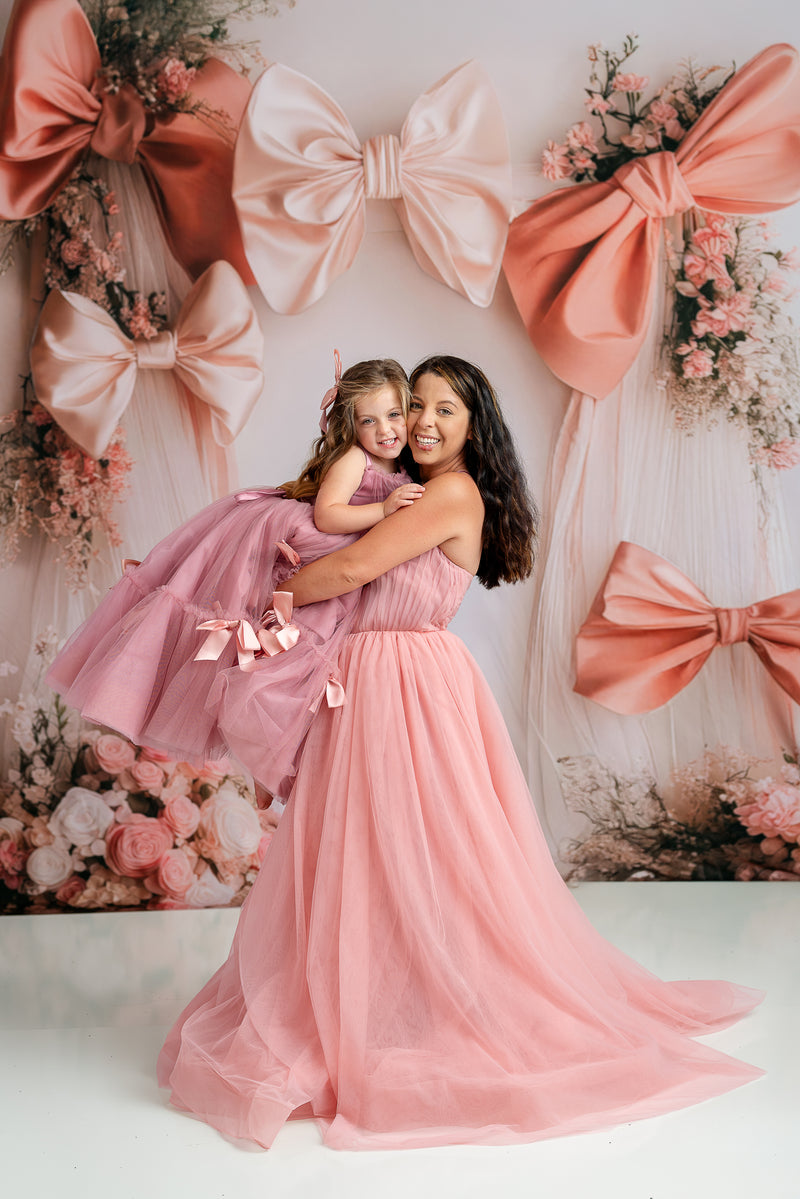 Ethereal floor-length pink tulle gown styled with detachable sleeves

