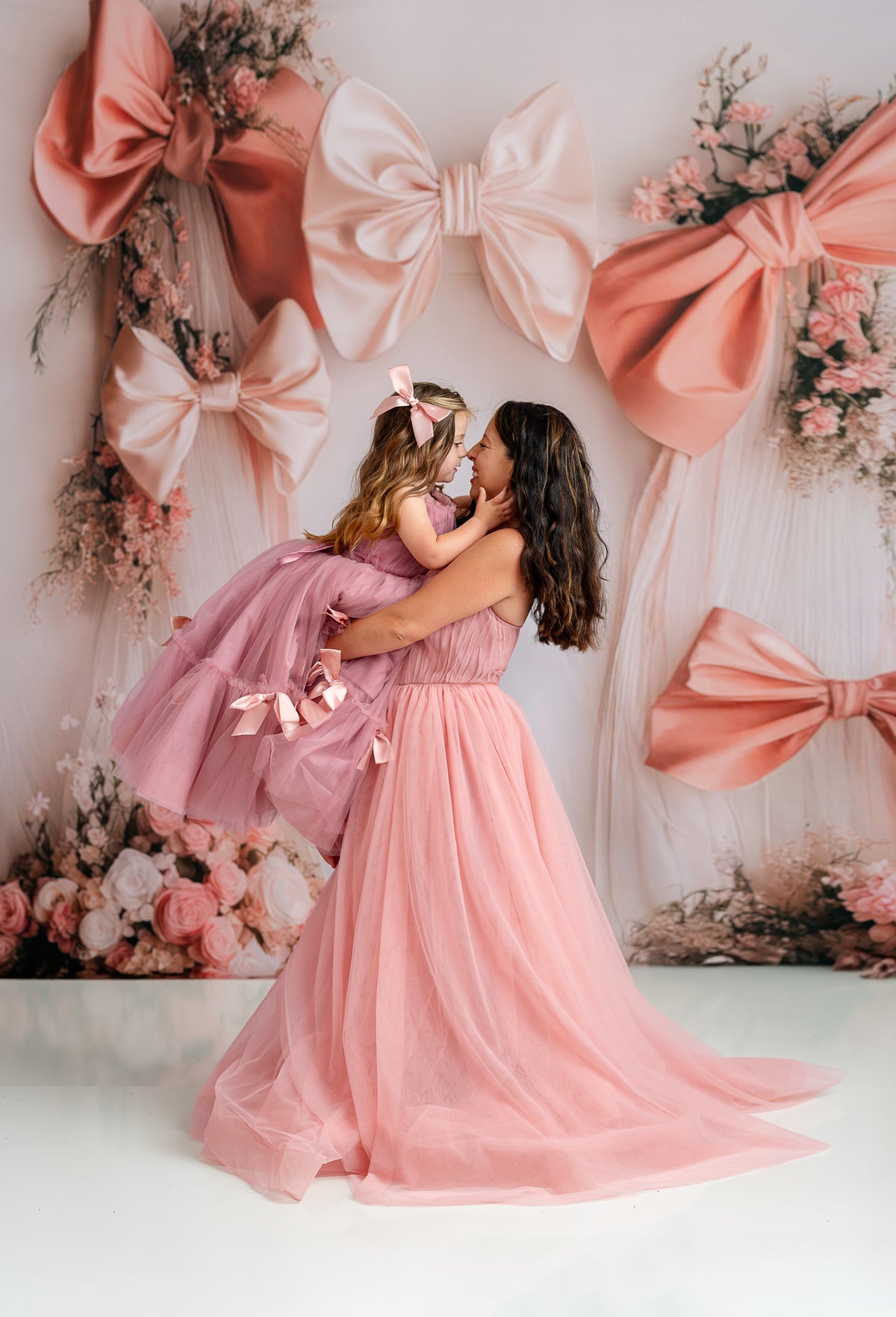 Model wearing the Rosewater Radiance pink tulle gown with sweetheart neckline and ruched bodice

