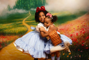 Two young girls in dresses with a colorful, painted landscape background