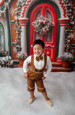 boy wearing custom gingerbread themed suspender shorts