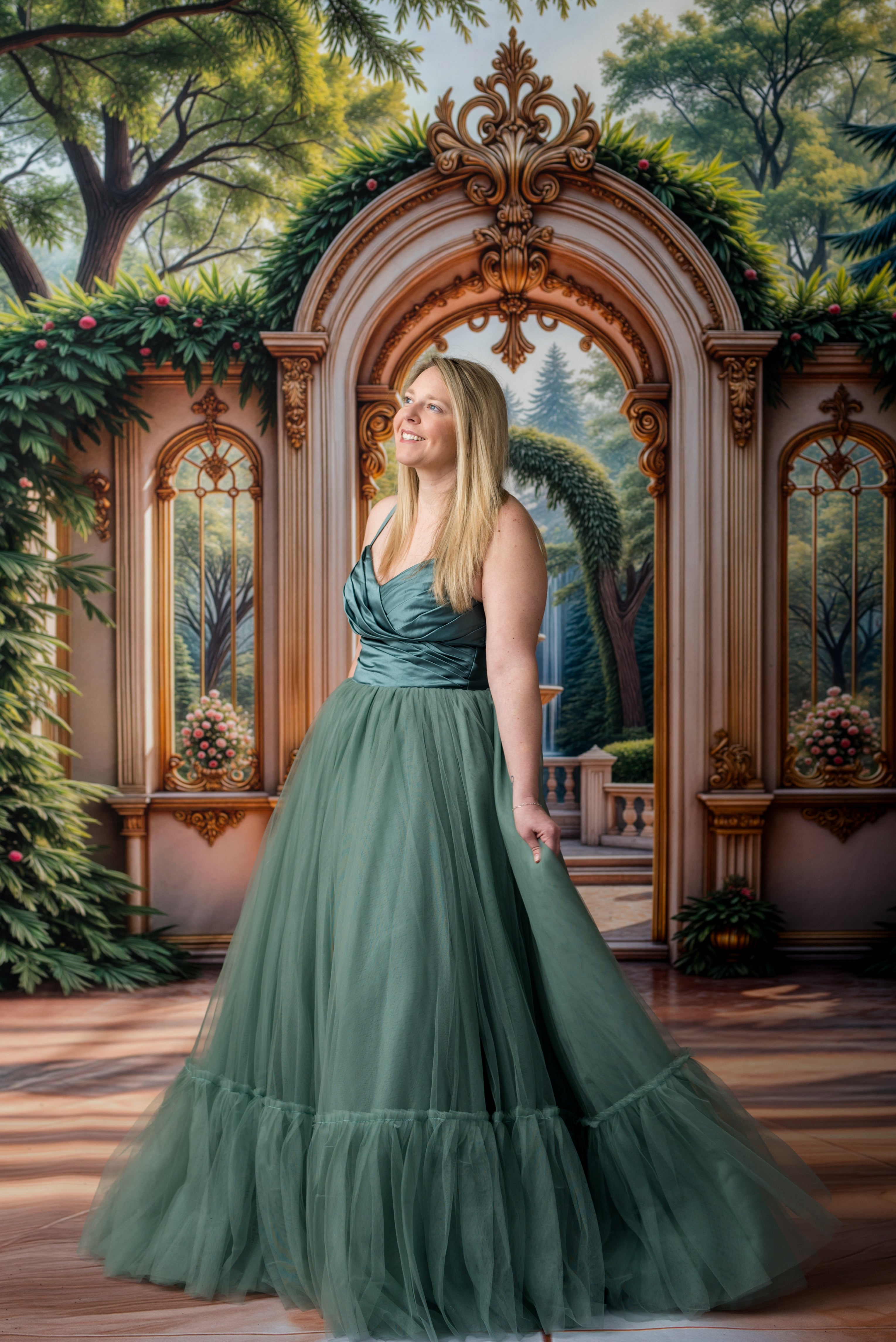 Woman in a green dress standing in front of an ornate archway with decorative elements.