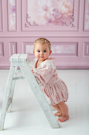 Styled session featuring blush velvet baby romper

