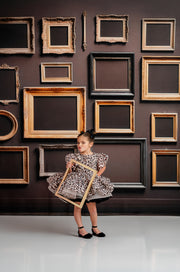 "This leopard print dress is the ultimate statement for little girls' birthday parties and unique photography sessions."






