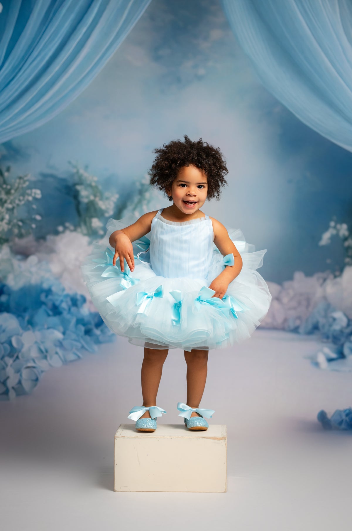 Bows of Grace short gown with soft tulle and satin bow details.

