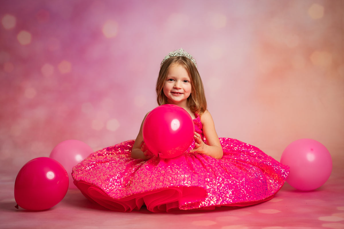 Girl twirling in short sparkle dress


