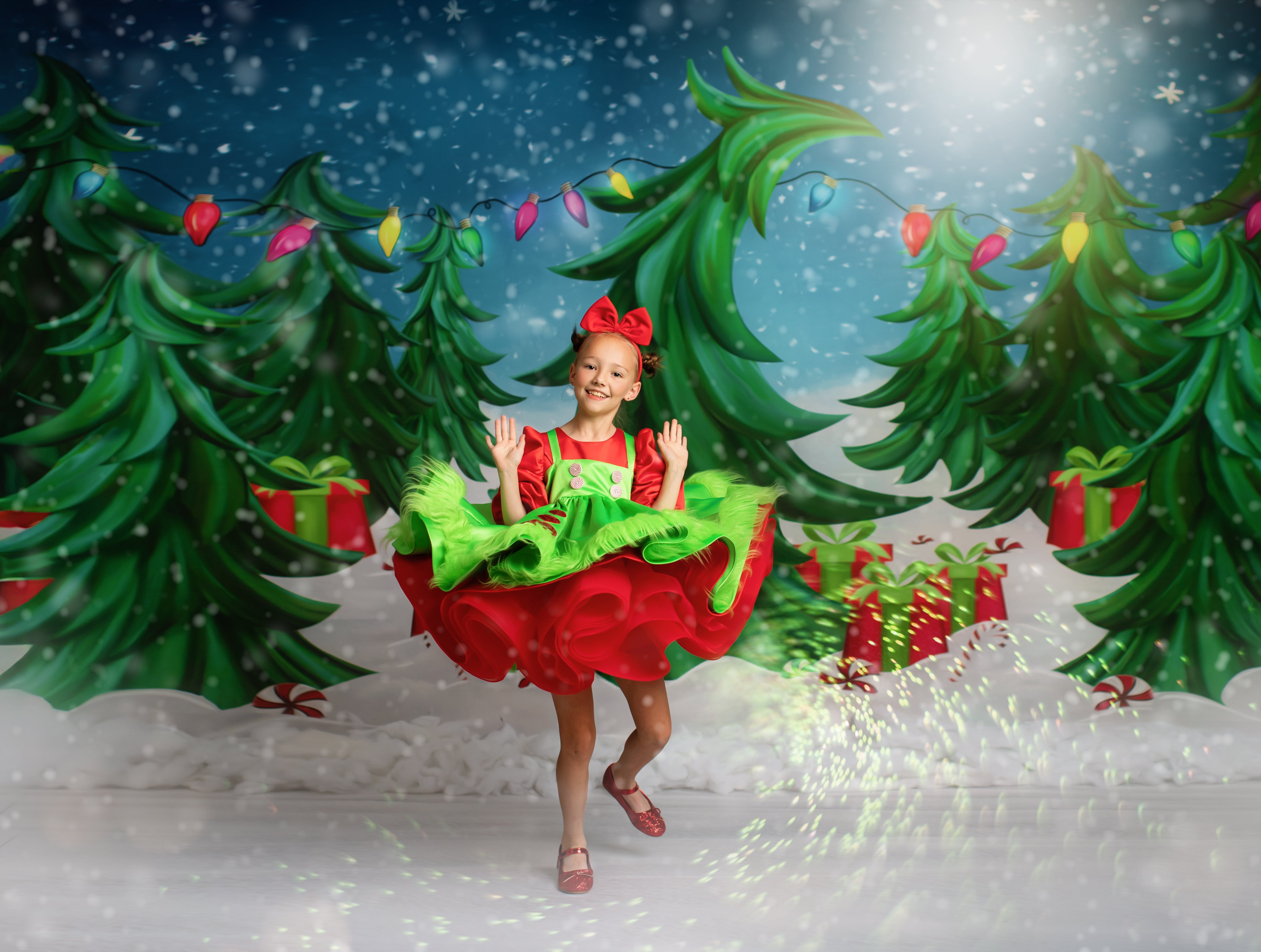 Holiday joy captured in a vibrant photo of two kids wearing cheerful green and red outfits with whimsical designs.
