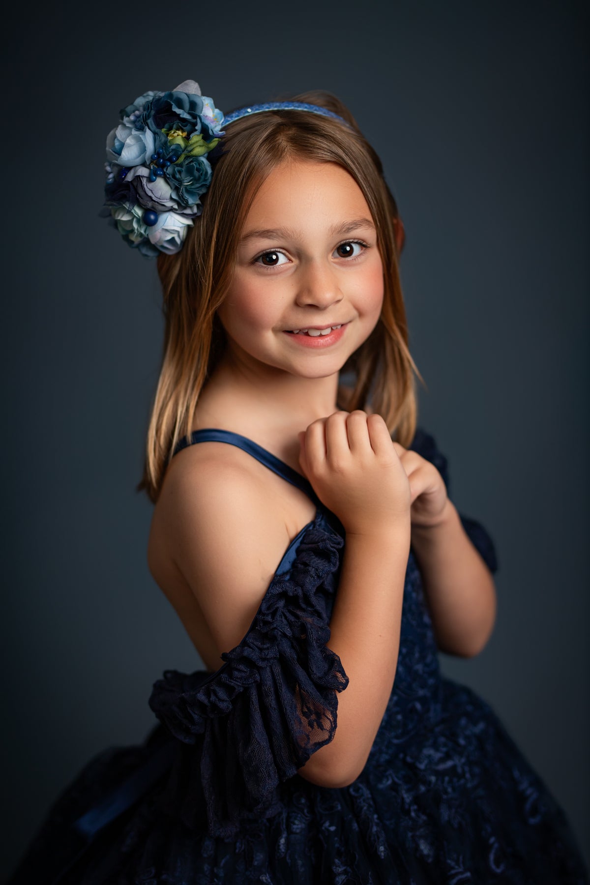 "Portrait-ready couture gown for girls in romantic lace and flowing skirt design"

