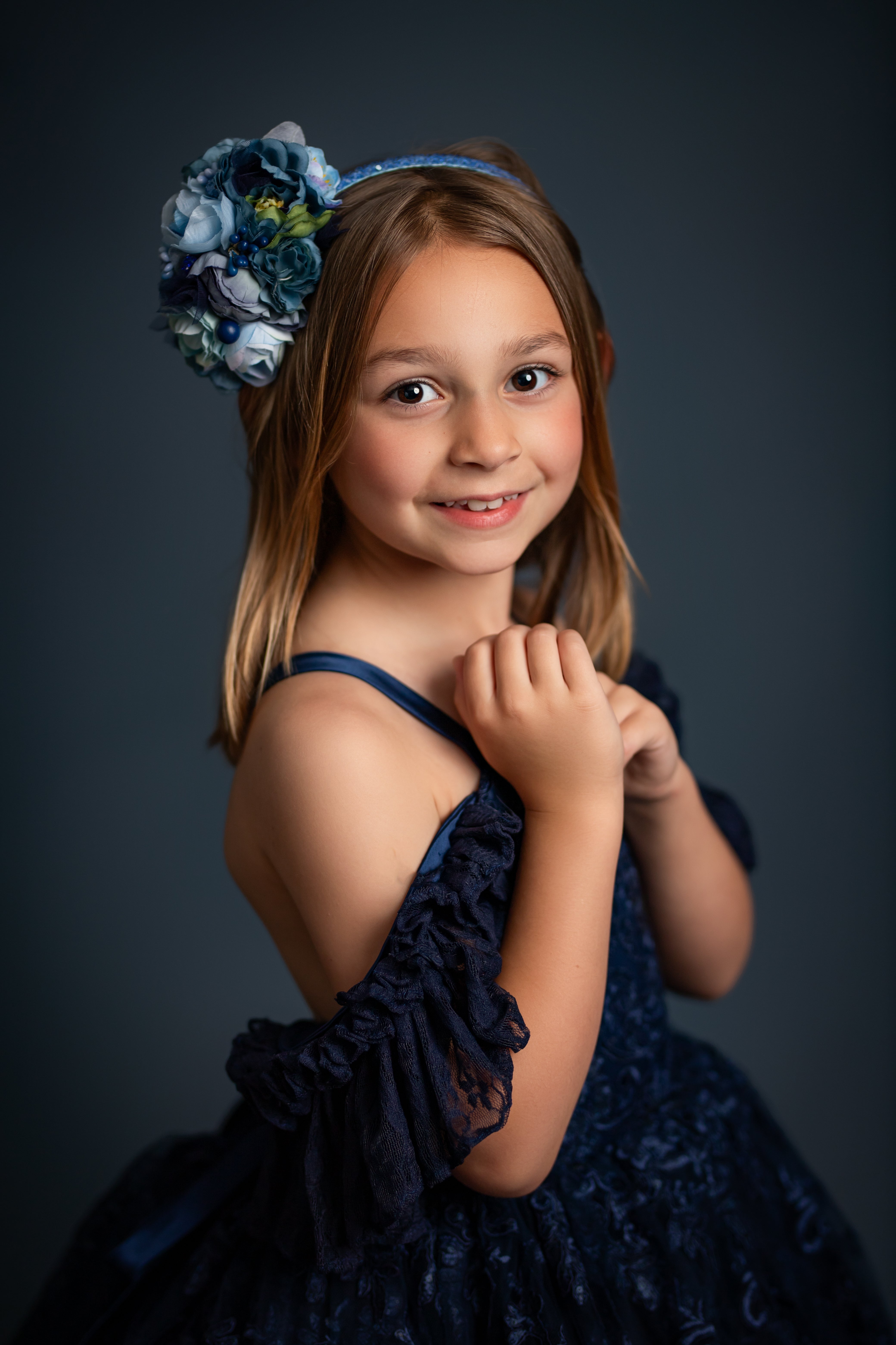 "Portrait-ready couture gown for girls in romantic lace and flowing skirt design"

