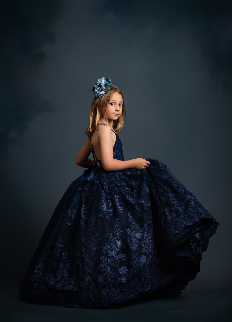 "Custom floor-length gown with voluminous layers of bridal tulle and adjustable straps"

