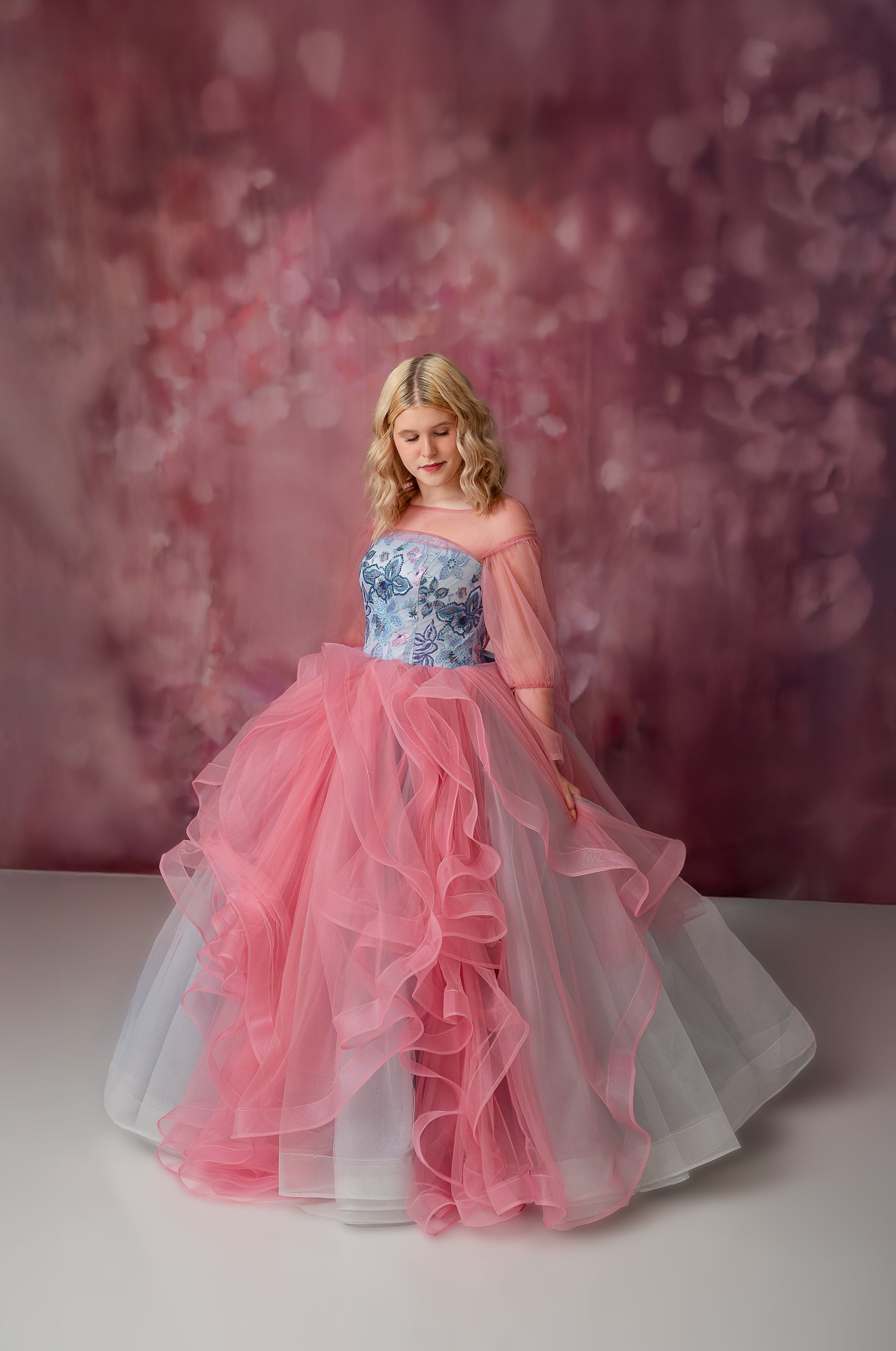 "This luxurious 'Blush & Blossoms' gown features a floor-length design and a beautiful closed-shoulder bodice, perfect for princess-like moments."
