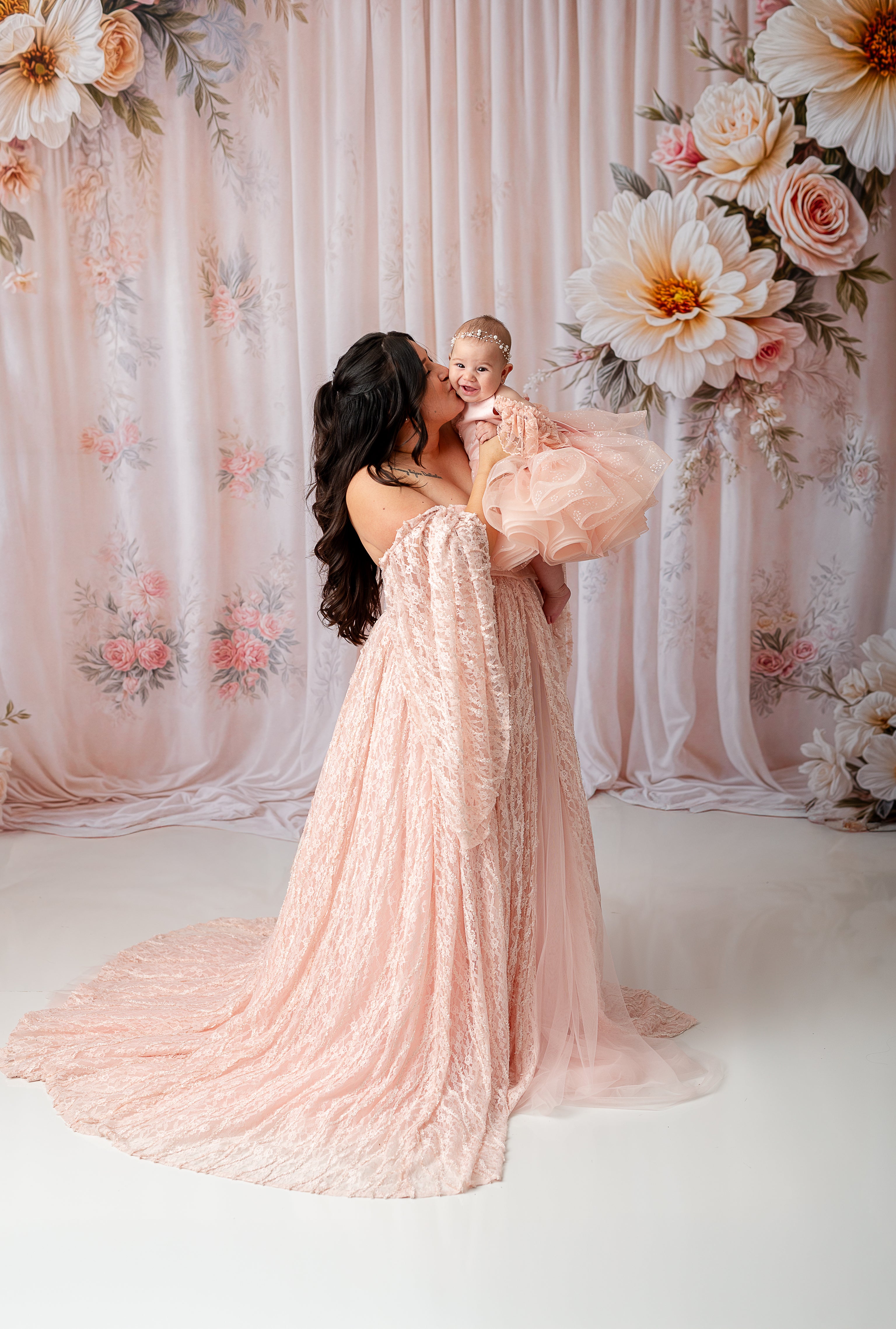 "Elegant maternity gowns designed for comfort and style, featuring luxurious fabrics and flattering silhouettes, perfect for capturing beautiful moments during pregnancy photoshoots."