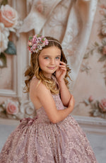 Timelessly elegant couture gown adorned with shimmering lace accents.

