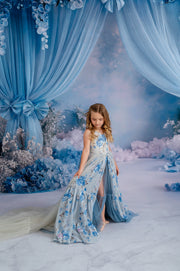 Child wearing Hillary solid couture gown in soft pastel tone with split front skirt.

