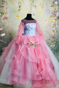 Elegant pink and blue couture gown with ruffled tulle layers, designed by Bentley + Lace.
