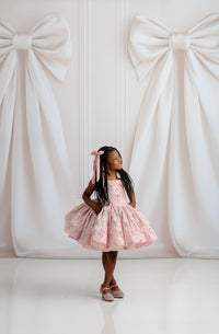 Bentley + Lace luxury girls dress featuring rich red velvet bodice and full satin skirt with vintage-inspired details.

