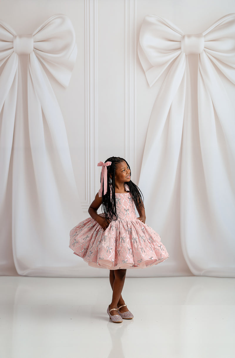 Bentley + Lace luxury girls dress featuring rich red velvet bodice and full satin skirt with vintage-inspired details.

