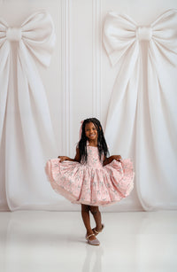 Close-up of Bentley + Lace dress showcasing plush velvet fabric and glossy satin accents.

