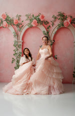 Model twirling in Sugar Rosette gown, showing textured layers and silhouette