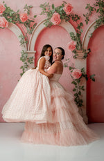 Mother and daughter wearing matching Sugar Rosette gowns in soft natural light