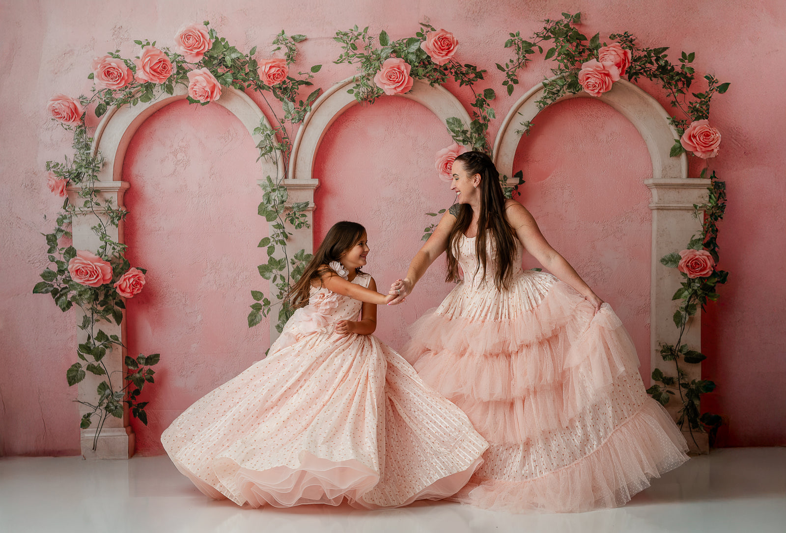 Sugar Rosette gowns on mom and daughter in an outdoor golden hour shoot