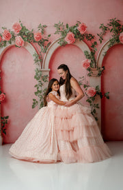 Full-length shot of Sugar Rosette dress with lace and dotted flower accents on child

