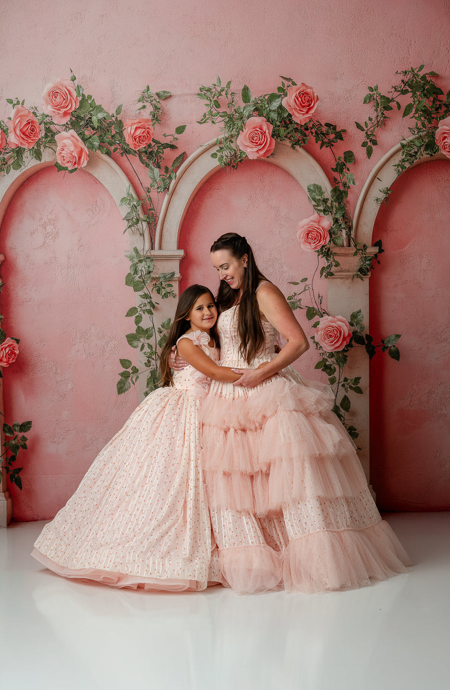 Full-length shot of Sugar Rosette dress with lace and dotted flower accents on child

