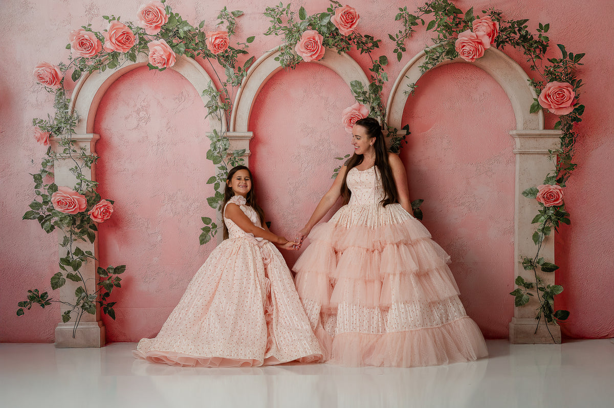 Detail of flowing chiffon skirts on matching Mommy and Me Sugar Rosette gowns

