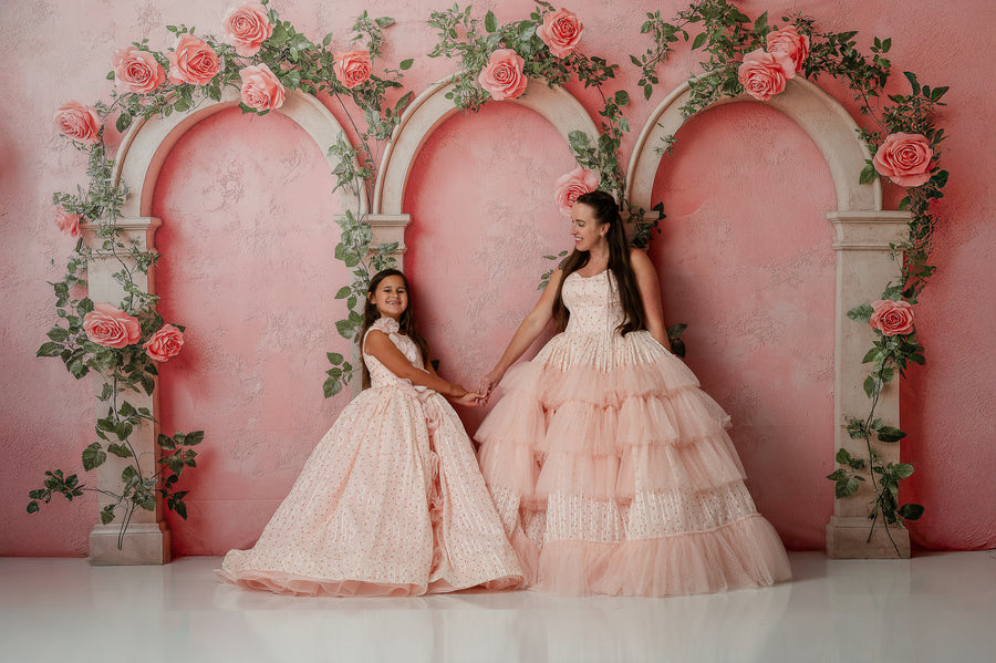 Detail of flowing chiffon skirts on matching Mommy and Me Sugar Rosette gowns


